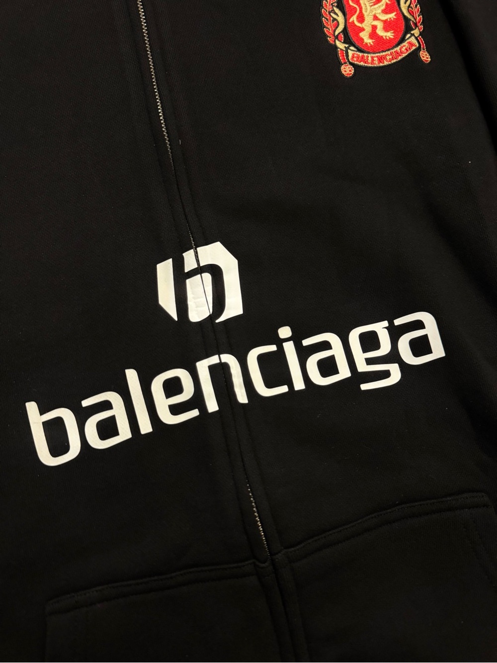 Balenciaga Black Full-Zip Hoodie with White Logo and Red Crest - Picture 2 of 6